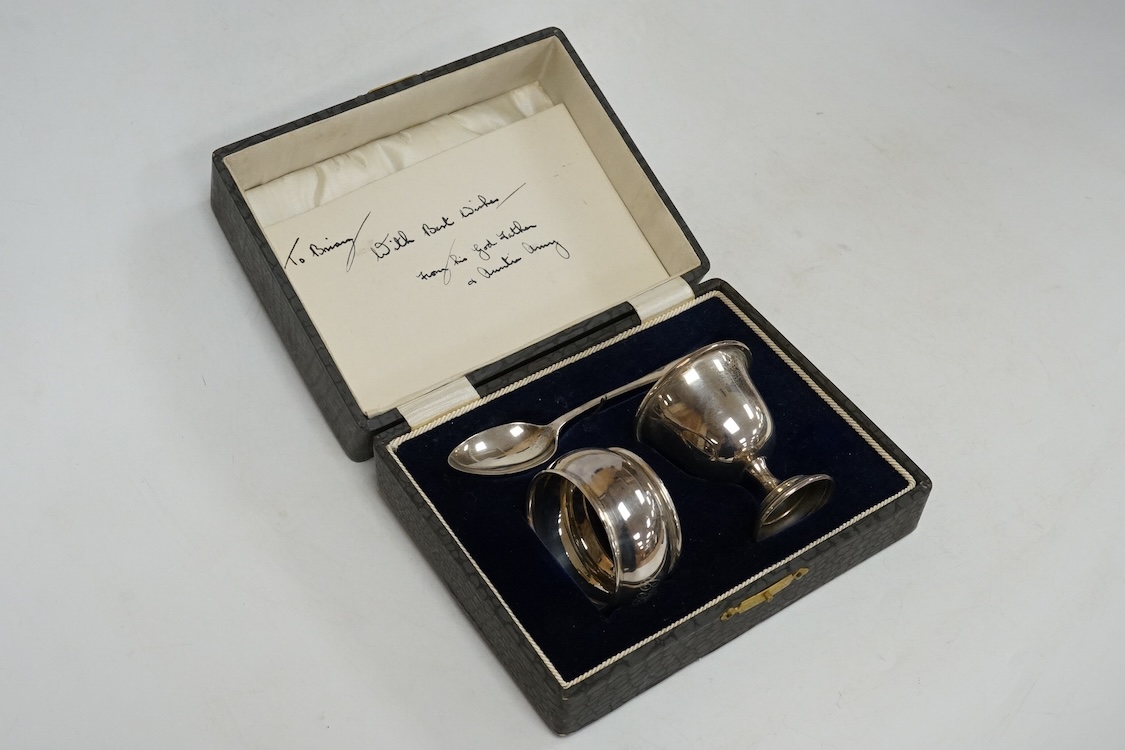 Three assorted silver christening sets including spoon, fork and napkin ring by William Hutton & Sons, London, 1896, one other set with steel knife, two cased sets of silver coffee spoons and a cased set of six Japanese